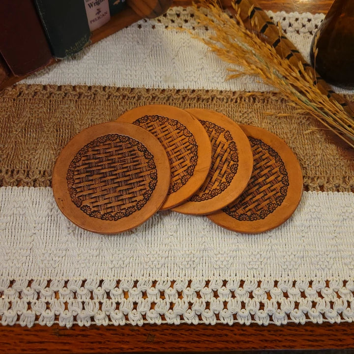 Set of 4 handmade leather coasters with a half daisy and basketweave design