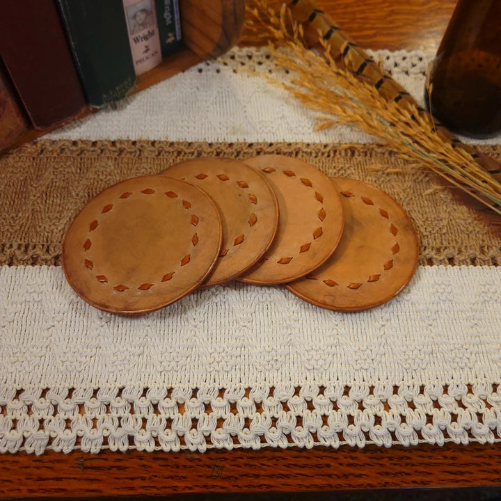 Set of 4 handmade leather coasters with light buckstitch leather lacing