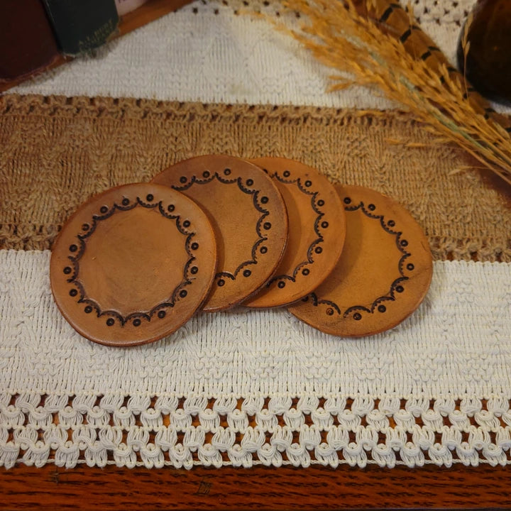 Set of 4 handmade leather coasters with a scallop/valley dot design