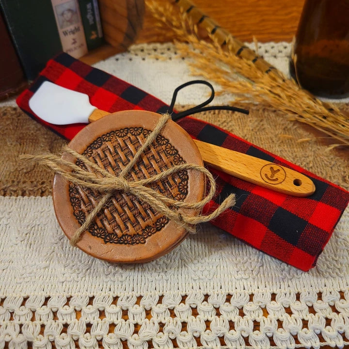 western gift set with handmade (daisy basket weave) leather coasters, white mini-spatula, and red/black plaid towel