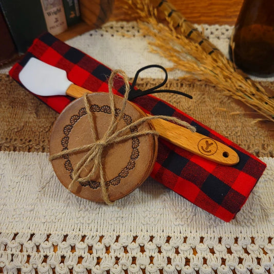 western gift set with handmade (half daisy) leather coasters, white mini-spatula, and red/black plaid towel